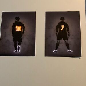Two posters Messi and Ronaldo